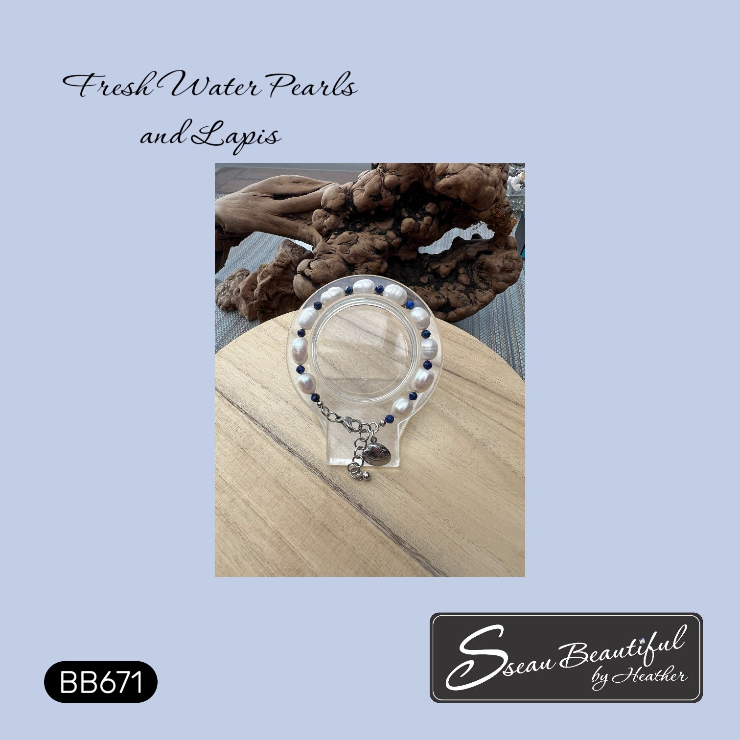 A bracelet made with Fresh Water baroque Pearls and faceted Lapis displayed on an acrylic stand,  shown on a wooden surface with a blurred natural background. The image includes text reading 'Fresh Water Pearls and Lapis' and branding for 'Sseau Beautiful by Heather' with style code BB671.