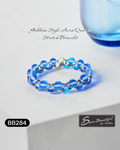 Blue beaded bracelet on a white surface with 'Sseau Beautiful' branding.