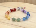 Multicolored beaded bracelet on a wooden surface