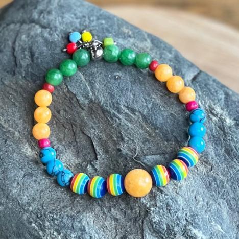 Colorful beaded bracelet on a dark stone surface