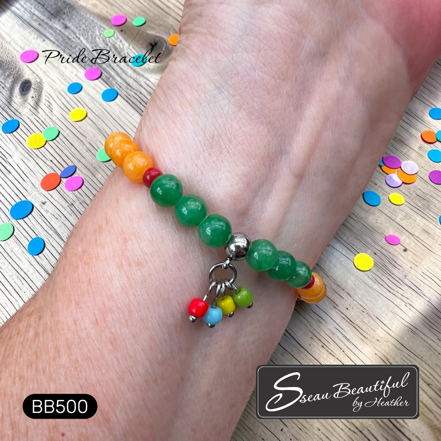 Colorful beaded bracelet on the inside of a wrist showing the colorful dangles and "Sseau Beautiful" brand logo in the corner.