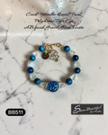 Adjustable 6.69 inch bracelet with a Czech Glass focal, Blue Tiger Eye rounds, AB finished Glass Nuggets, matching dangle, and a Stainless Steel Lobster Clasp and Extender 