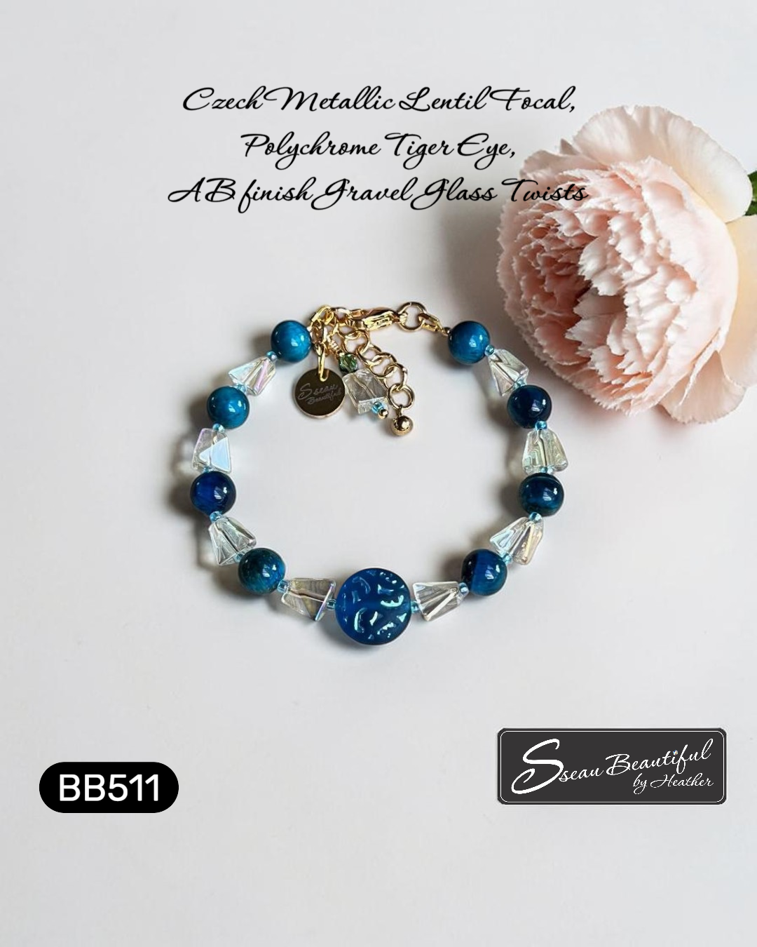 Adjustable 6.69 inch bracelet with a Czech Glass focal, Blue Tiger Eye rounds, AB finished Glass Nuggets, matching dangle, and a Stainless Steel Lobster Clasp and Extender 