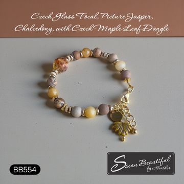 Adjustable Bracelet featuring a gorgeous Czech Firepolish Focal accented with a Maple Leaf Dangle