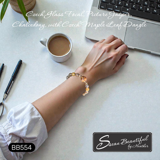 Adjustable Bracelet featuring a gorgeous Czech Firepolish Focal accented with a Maple Leaf Dangle