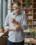 Man wearing a bracelet with text about gemstones in a cafe setting