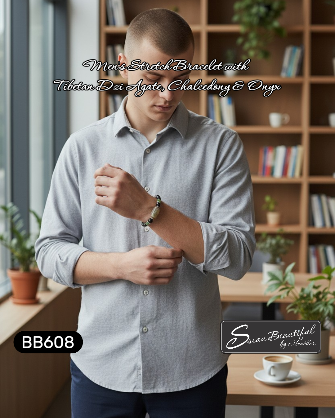 Man wearing a bracelet with text about gemstones in a cafe setting