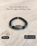 Men's stretch bracelet with Tibetan Dzi Agate, Chalcedony, and Onyx on a wooden surface, featuring the brand 'Sseau Beautiful by Heather'.