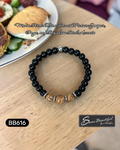 Black beaded bracelet with brown beads and silver accents, on a wooden surface, with text overlay.
