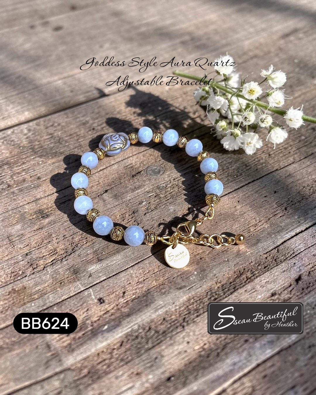 Bracelet with blue beads and gold accents on a wood surface, featuring 'Sseau Beautiful by Heather' branding.