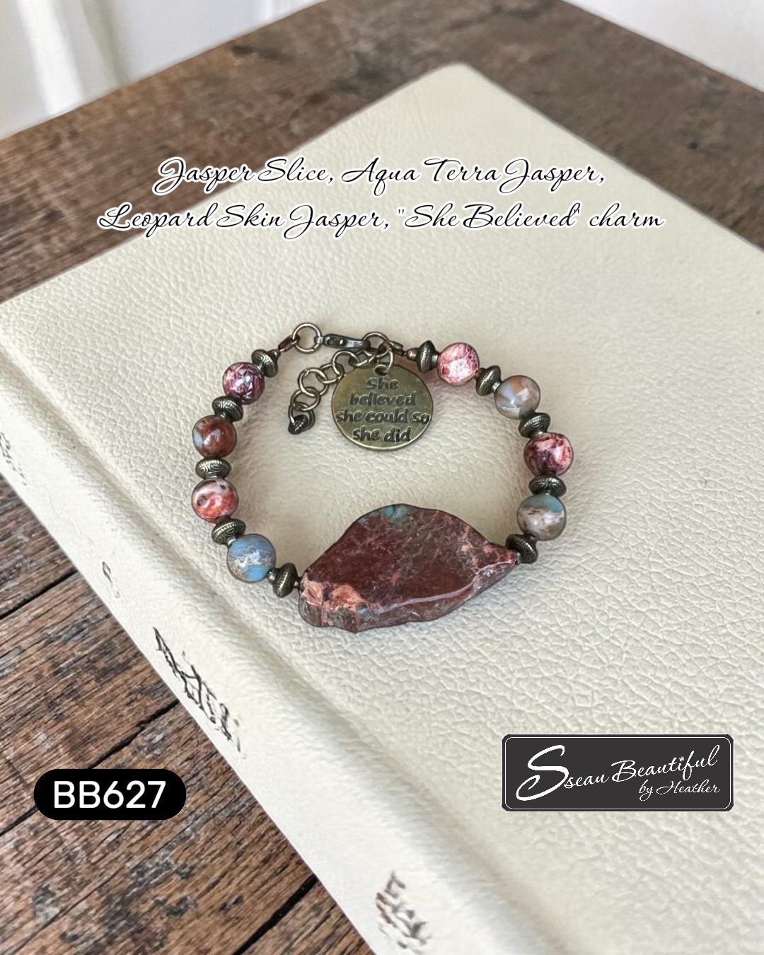 Adjustable bracelet with a large stone slice focal, with stone beads and metal spacers, and a charm with the text "she believed she could so she did" on a white book