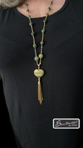 Serpentine and B.C. Jade necklace worn over a black t-shirt, SSeau Beautiful logo in bottom corner