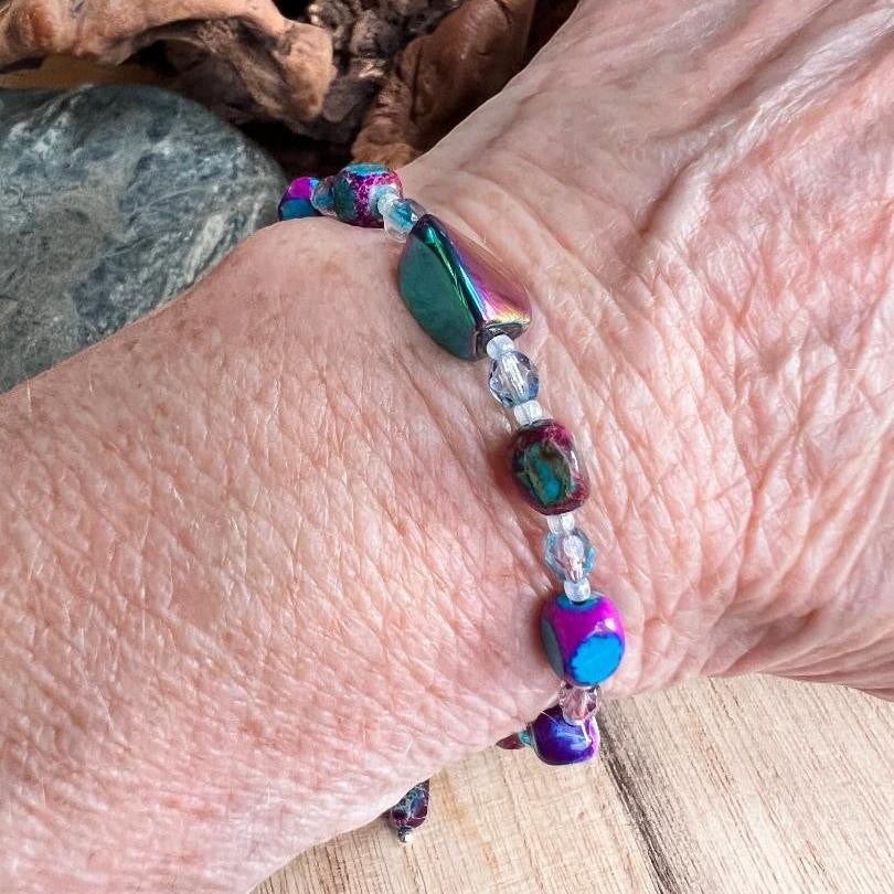 Sseau Beautiful! blue-purple Imperial Jasper and electroplated glass twist bracelet with Czech crystals on a wrist.