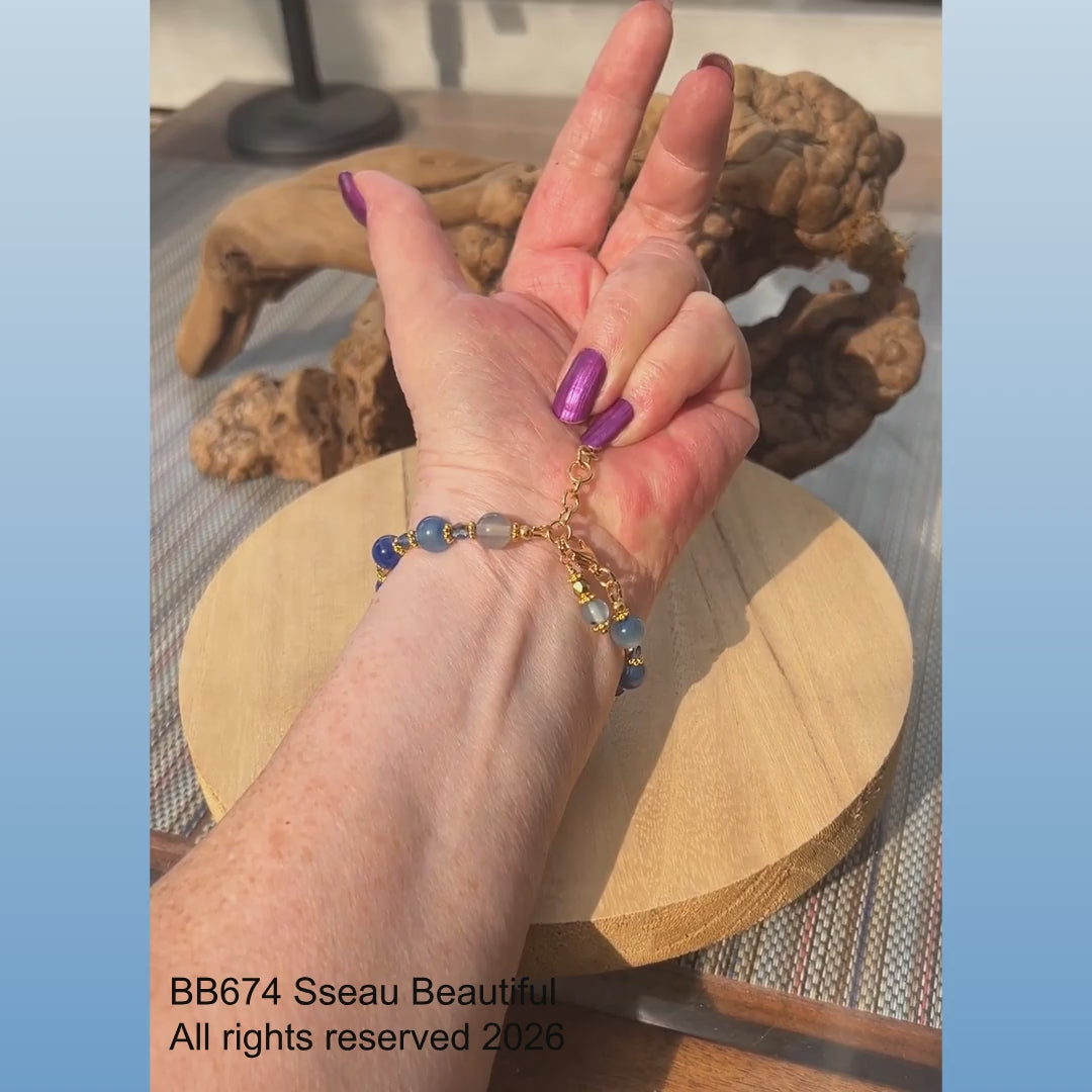 video showing a bracelet worn on a woman's slowing turning arm, then changing to a shot of the same bracelet shown on a rotating stand.