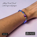 Sseau Beautiful! blue-purple imperial jasper and electroplated glass twist bracelet with Czech crystals on a wrist.