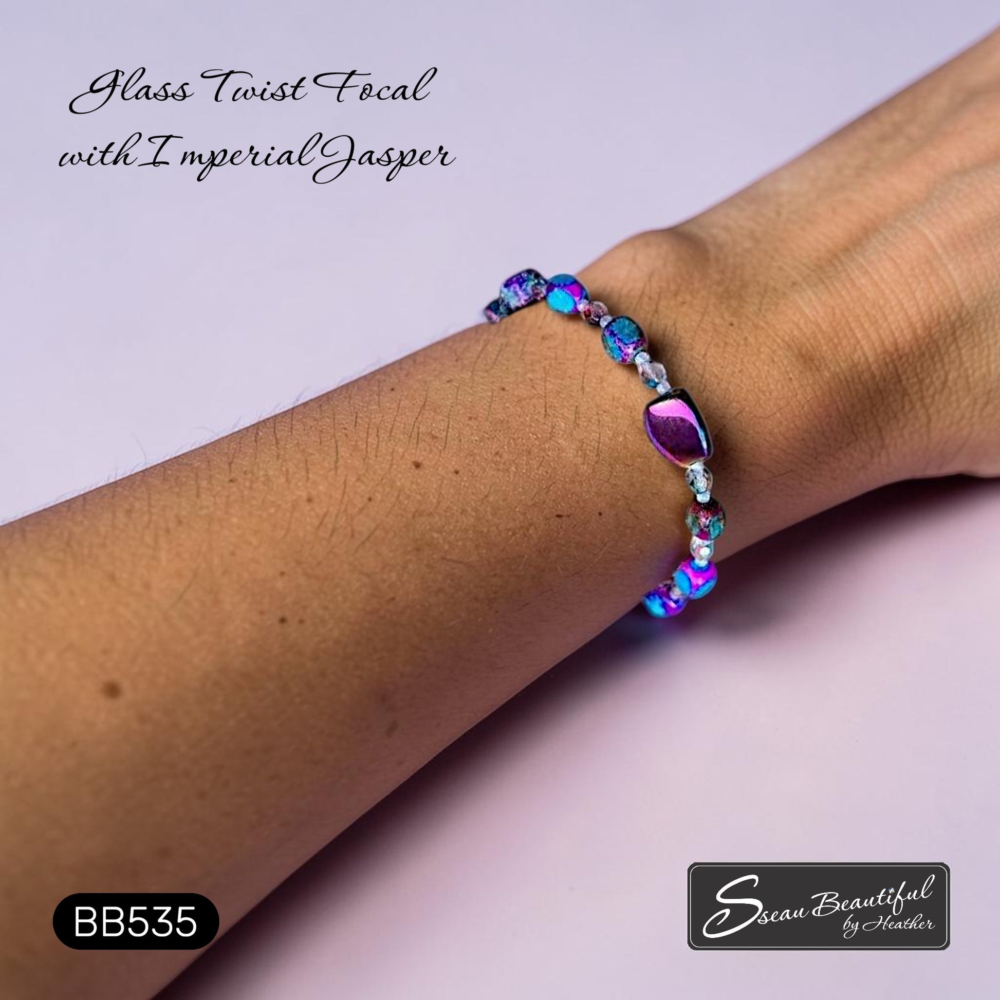 Sseau Beautiful! blue-purple imperial jasper and electroplated glass twist bracelet with Czech crystals on a wrist.
