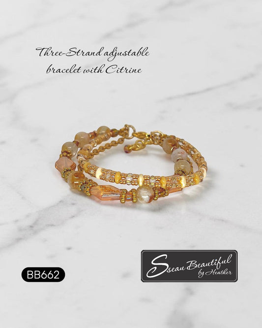Sseau Beautiful! warm gold three-strand adjustable bracelet with citrine beads and faceted glass accents.