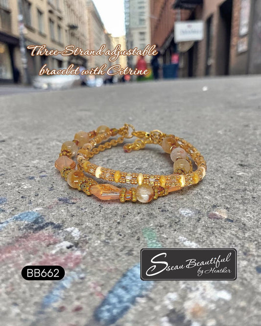 Sseau Beautiful! warm gold three-strand adjustable bracelet with citrine beads and faceted glass accents.