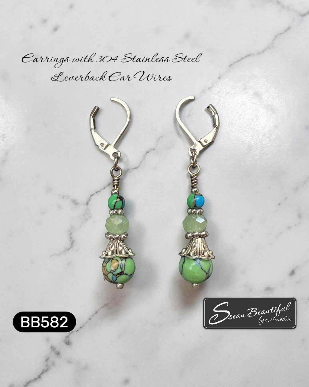 Sseau Beautiful! handcrafted dangle earrings with green howlite, blue accents, and faceted green crystal, 304 stainless steel leverbacks.