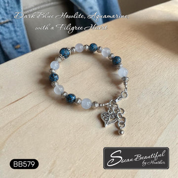 Sseau Beautiful! adjustable bracelet with dark blue Howlite, Aquamarine beads, and filigree heart charm.