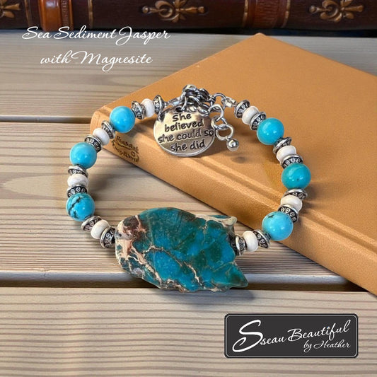 Sseau Beautiful! adjustable bracelet with Sea Sediment Jasper slice, turquoise Magnesite beads, cream Magnesite spacers, and "She believed she could so she did" charm.