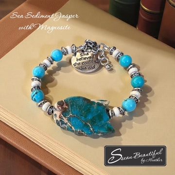 Sseau Beautiful! adjustable bracelet with Sea Sediment Jasper slice, turquoise Magnesite beads, cream Magnesite spacers, and engraved "She believed she could so she did" charm.