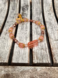 Sseau Beautiful! Strawberry Dream stretch bracelet with rose quartz, strawberry quartz, crystals, and butterfly charm.