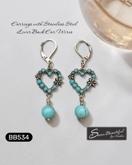 Sseau Beautiful! turquoise heart dangle earrings with floral accents and stainless steel lever backs.