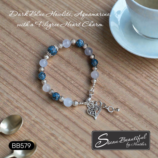 Sseau Beautiful adjustable bracelet with dark blue Howlite, aquamarine beads, and filigree heart charm.