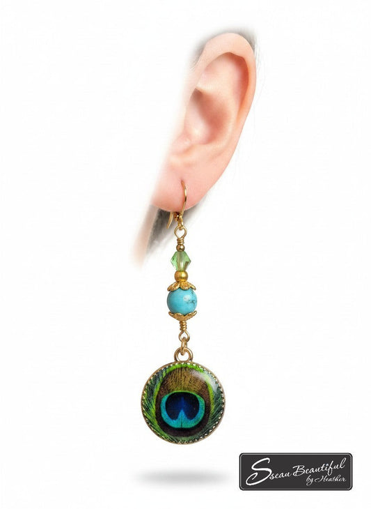 Sseau Beautiful! bohemian peacock feather dangle earrings with turquoise bead and green crystal accents on gold lever-back hooks.