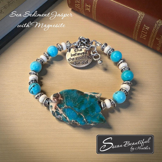 Sseau Beautiful! adjustable bracelet with Sea Sediment Jasper slice, turquoise Magnesite beads, cream Magnesite spacers, and "She believed she could so she did" charm.