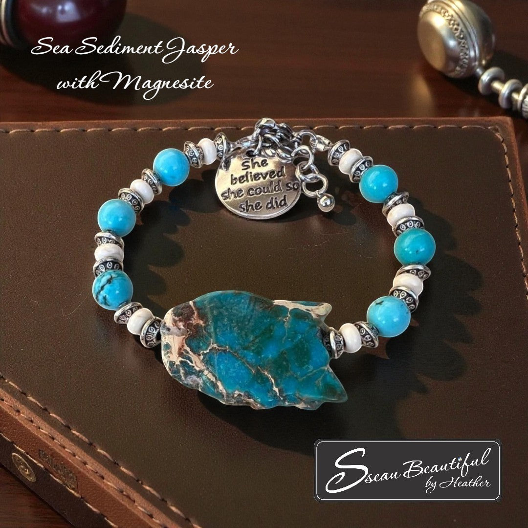 Sseau Beautiful! adjustable bracelet with Sea Sediment Jasper slice, turquoise Magnesite beads, cream Magnesite spacers, and "She believed she could so she did" charm.