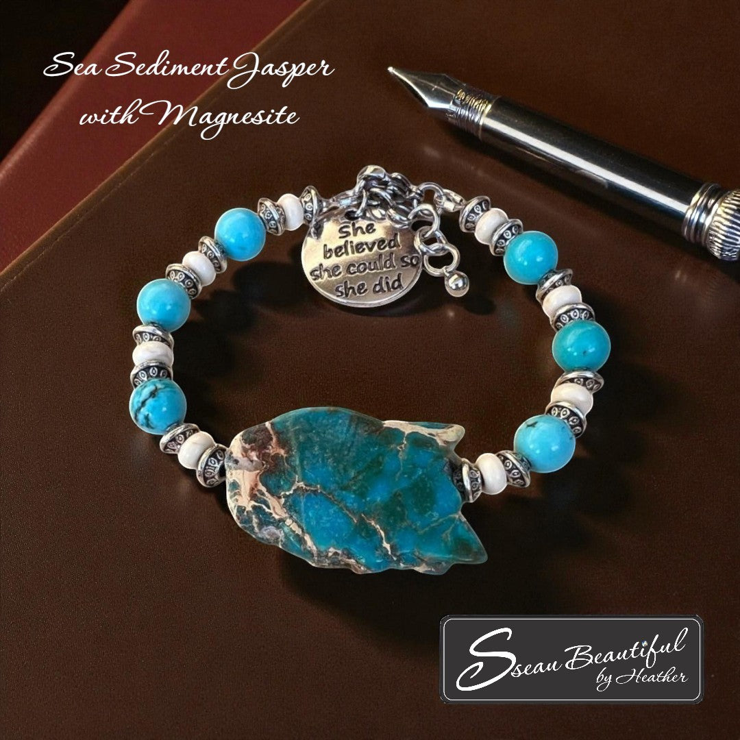 Sseau Beautiful! adjustable bracelet with Sea Sediment Jasper slice, turquoise Magnesite beads, cream Magnesite spacers, and engraved "She believed she could so she did" charm.