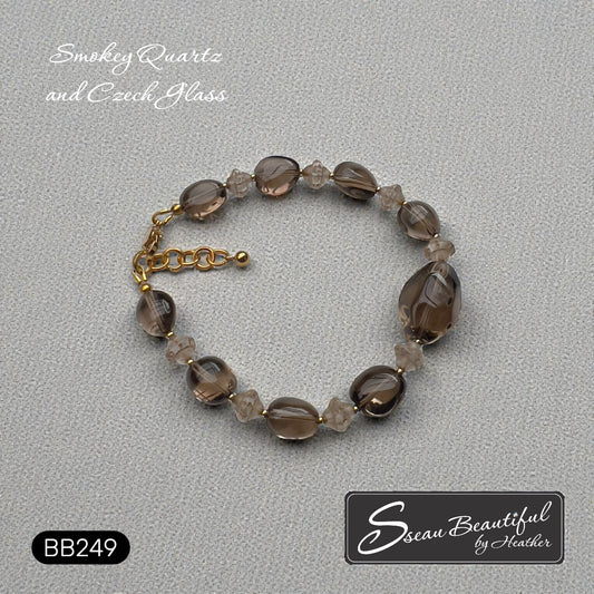 Sseau Beautiful! adjustable bracelet with smokey quartz nuggets and Czech glass, 18k gold-plated spacers, gold-tone clasp.
